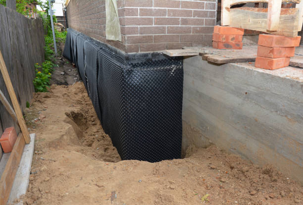 SJ Waterproofing Pros technician performing targeted Wet Basement Repair assessment in Lockport, KY